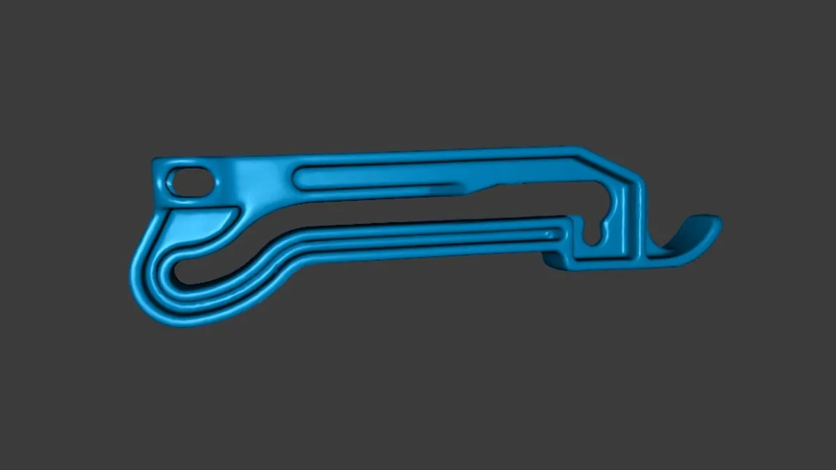 3D scan mesh of the tractor side-mirror arm, rebuilt geometry shown as a blue render